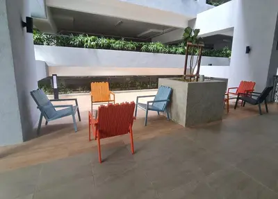 a group of chairs and tables in a building at Cozy Modern Tiny Home 2R1B 10 mins to KLCC in Kuala Lumpur