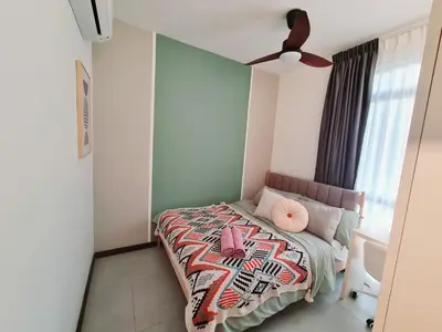 a small bedroom with a bed with a pink pillow at Cozy Modern Tiny Home 2R1B 10 mins to KLCC in Kuala Lumpur
