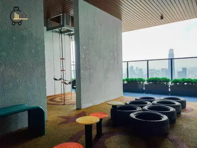a room with a row of stools in a building at 1 min to KL Tallest Residence Heart of Klang Valley in Kuala Lumpur