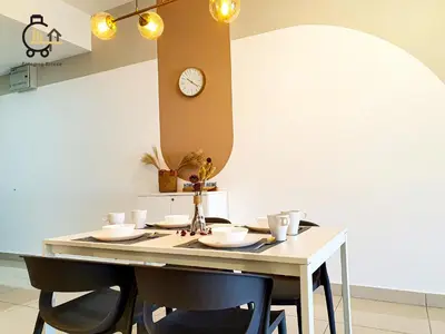 a dining room table with chairs and a clock on the wall at 1 min to KL Tallest Residence Heart of Klang Valley in Kuala Lumpur