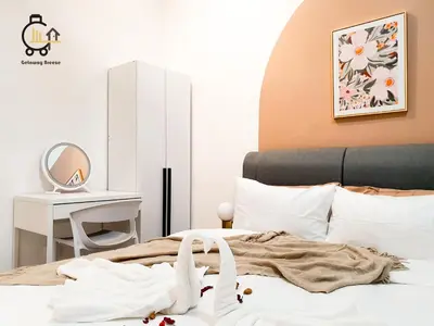a bedroom with a bed with a table and a mirror at 1 min to KL Tallest Residence Heart of Klang Valley in Kuala Lumpur
