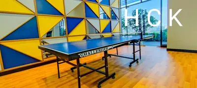 a ping pong table in front of a wall at Luxury Balcony at Trion KL by HCK in Kuala Lumpur