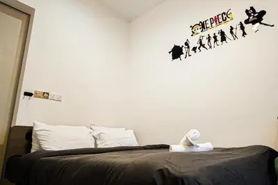 a bedroom with a bed and a wall with a harry potter sticker at Luxury Balcony at Trion KL by HCK in Kuala Lumpur