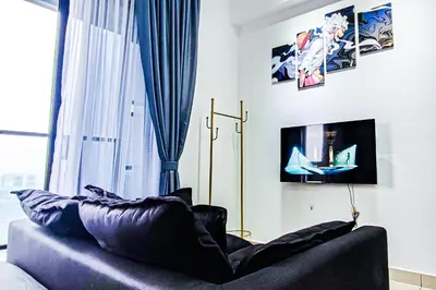 a living room with a couch in front of a window at Luxury Balcony at Trion KL by HCK in Kuala Lumpur