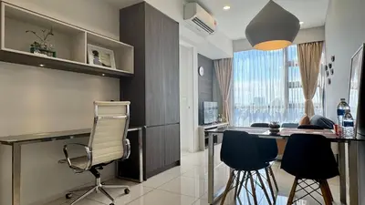 a kitchen with a table and chairs in a room at Panoramic KL View @Robertson Bukit Bintang 40f in Kuala Lumpur