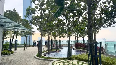 a pool on the top of a building with trees at Panoramic KL View @Robertson Bukit Bintang 40f in Kuala Lumpur