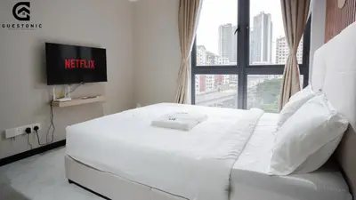 a white bed in a room with a window at NeuSuite Cozy Studio by GUESTONIC in Kuala Lumpur