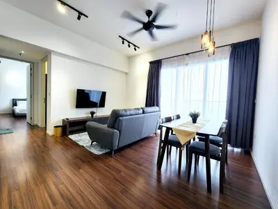 a living room with a couch and a table at Infini Suites@ UNA Residences, Sunway Velocity KL in Kuala Lumpur