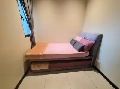 a small bed sitting in a corner of a room at Homeaway 2R1B 10 mins to KLCC in Kuala Lumpur
