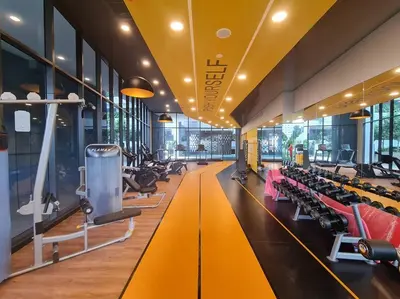 a gym with rows of treadmills and machines at Homeaway 2R1B 10 mins to KLCC in Kuala Lumpur