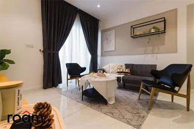 a living room with a couch and a table and chairs at Quill Residences KLCC, Five Senses in Kuala Lumpur