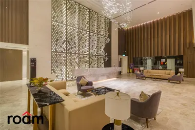 a lobby with couches and chairs in a building at Quill Residences KLCC, Five Senses in Kuala Lumpur