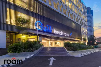 a building with a sign on the side of it at Quill Residences KLCC, Five Senses in Kuala Lumpur