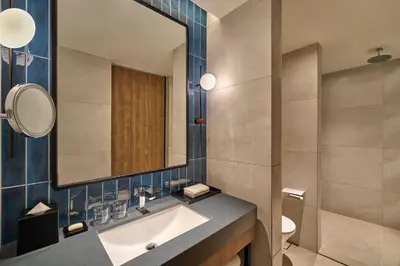 a bathroom with a sink and a mirror at Four Points by Sheraton Kuala Lumpur, City Centre in Kuala Lumpur