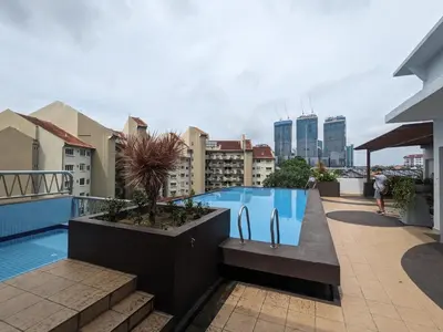 a swimming pool on the roof of a building at Damansara Studio in Kuala Lumpur