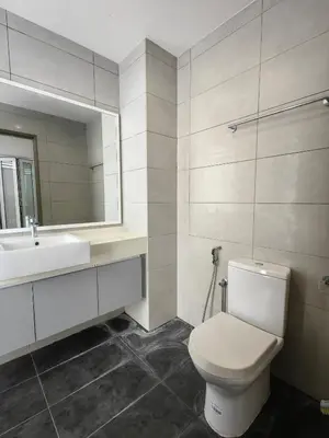 a bathroom with a white toilet and a sink at SETAPAK CENTRAL KL - Lavender Zetapark Suite in Kuala Lumpur