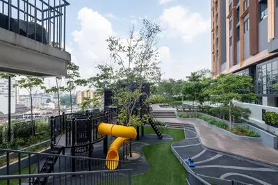 a playground in a building with a slide at Cute Dinosaur Kids Theme@Lucentia LalaPort BBCC in Kuala Lumpur