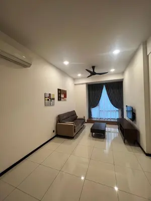 a living room with a couch and a ceiling fan at Opus Residences 2 Bedroom Apartment in Kuala Lumpur