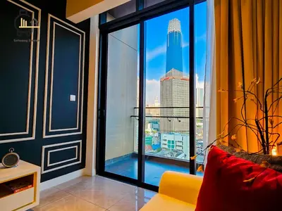 a room with a large window with a view of a city at 1 min to Pavilion KL Heart of Bukit Bintang by GBS in Kuala Lumpur