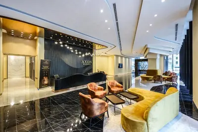 a lobby with leather chairs and a couch at 1 min to Pavilion KL Heart of Bukit Bintang by GBS in Kuala Lumpur