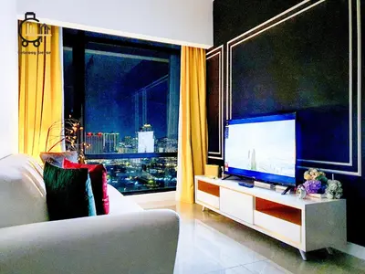 a living room with a large flat screen tv at 1 min to Pavilion KL Heart of Bukit Bintang by GBS in Kuala Lumpur