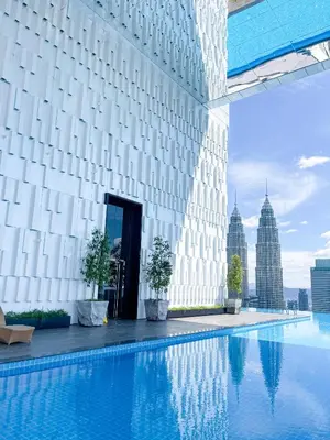 a view of a building with a swimming pool at KL Tower KLCC Pavilion by Kimiro in Kuala Lumpur