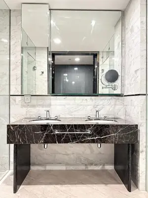 a bathroom with two sinks and a large mirror at KL Tower KLCC Pavilion by Kimiro in Kuala Lumpur