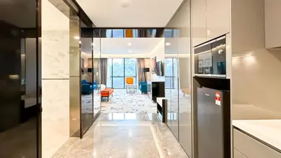 a kitchen with a hallway leading to a living room at KL Tower KLCC Pavilion by Kimiro in Kuala Lumpur