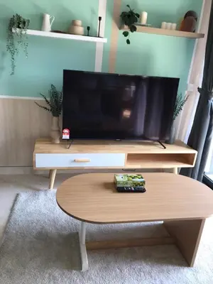 a living room with a tv and a coffee table at BBCC APARTMENT AT LUCENTIA 2 in Kuala Lumpur