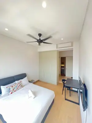 a bedroom with a bed and a ceiling fan at BBCC APARTMENT AT LUCENTIA 2 in Kuala Lumpur