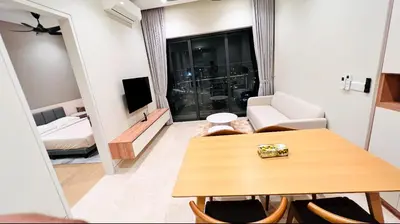 a living room with a table and a couch at BBCC APARTMENT AT LUCENTIA 2 in Kuala Lumpur