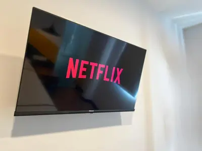 a television with the netflix sign on a wall at Seeds Hotel Chow Kit in Kuala Lumpur