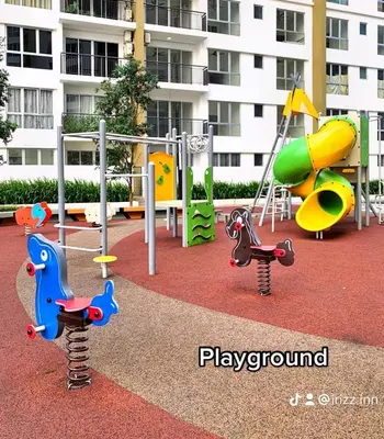 a playground with different types of play equipment in front of a building at Irizz Inn @Homestay Platinum Splendor in Kuala Lumpur