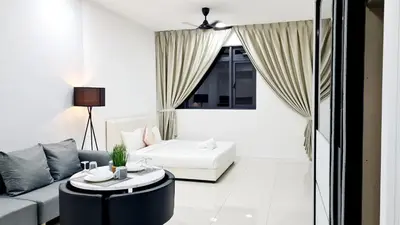 a living room with a couch and a table at Kualalampur Chambers KLCC By Sky Pool in Kuala Lumpur
