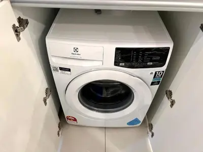 a washer and dryer in a room at Kualalampur Chambers KLCC By Sky Pool in Kuala Lumpur