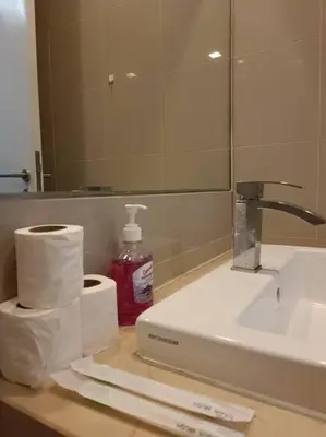 a bathroom counter with a sink and a mirror at RM218 Bukit Bintang Balcony Studio Infinity Pool in Kuala Lumpur