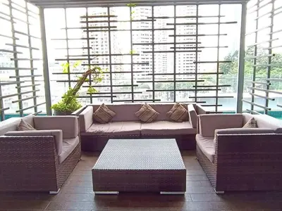 a large living room with a couch and a table at RM218 Bukit Bintang Balcony Studio Infinity Pool in Kuala Lumpur