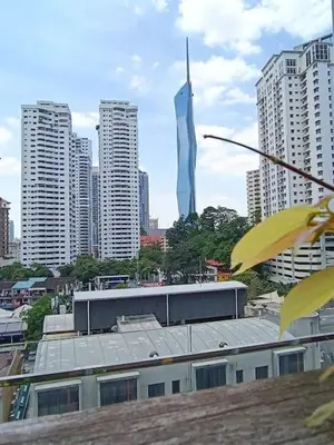 a view of a city skyline with a tall building at RM203A Bukit Bintang Balcony Studio Infinity Pool in Kuala Lumpur