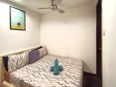 a room with a bed with a cactus on it at BBHomes at Bukit Bintang Casa Residency KL in Kuala Lumpur