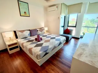 a bedroom with a bed with a teddy bear on it at BBHomes at Bukit Bintang Casa Residency KL in Kuala Lumpur