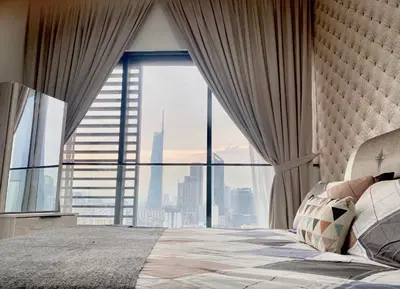 a bedroom with a large window with a view of the city at BBHomes at Continew Residensi Pudu KL digitalife in Kuala Lumpur
