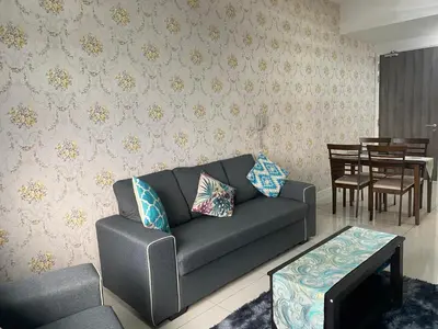 a living room with a couch and a table at BBHomes at Continew Residensi Pudu KL digitalife in Kuala Lumpur