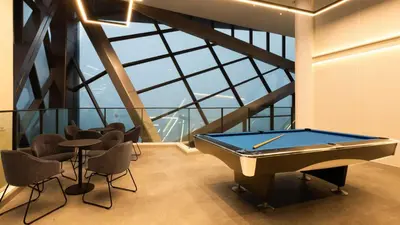 a pool table in a room with a large window at BBHomes at Continew Residensi Pudu KL digitalife in Kuala Lumpur