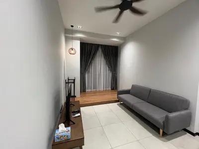a living room with a couch and a ceiling fan at Opus Residences 1 Bedroom Apartment in Kuala Lumpur