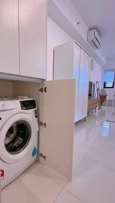 a kitchen with a washing machine in a room at Spacious Connecting Room 4px, Chambers Residence KL, Walking Distance to LRT, MRT, Sunway Putra Mall & PWTC in Kuala Lumpur