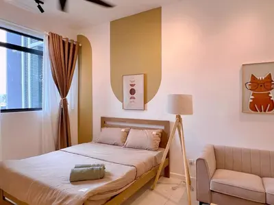 a bedroom with a bed and a couch and a window at Spacious Connecting Room 4px, Chambers Residence KL, Walking Distance to LRT, MRT, Sunway Putra Mall & PWTC in Kuala Lumpur