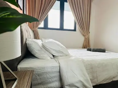 a bedroom with a bed with pillows and a window at MVD15#Family Suite 8pax 3 Rooms Sunway Velocity Mall Cheras IKEA Mytown Short Walk to MRT & LRT Maluri in Kuala Lumpur
