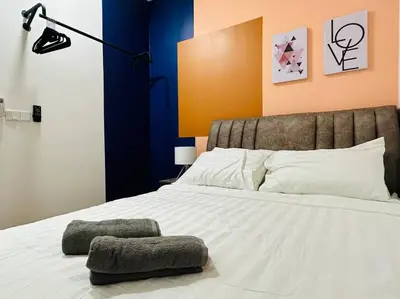 a bedroom with a large white bed with a lamp at MVD15#Family Suite 8pax 3 Rooms Sunway Velocity Mall Cheras IKEA Mytown Short Walk to MRT & LRT Maluri in Kuala Lumpur