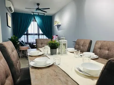 a dining room with a table with plates and glasses at MVD15#Family Suite 8pax 3 Rooms Sunway Velocity Mall Cheras IKEA Mytown Short Walk to MRT & LRT Maluri in Kuala Lumpur