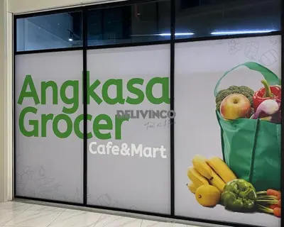 a sign for a grocery store with a bag of fruits and vegetables at The Luxe - 3 pax - KLCC View - Balcony at 27 floor in Kuala Lumpur